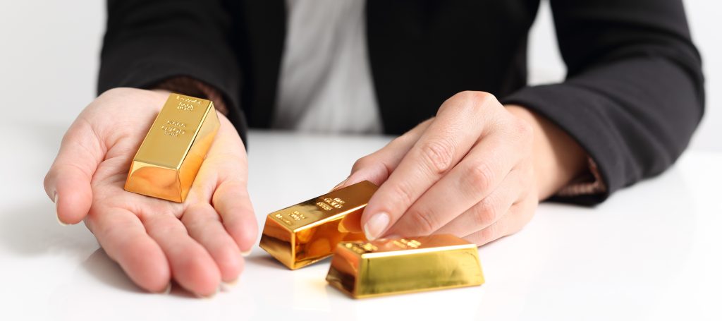 A,Business,Woman,Presents,Gold,Bullion,Bar